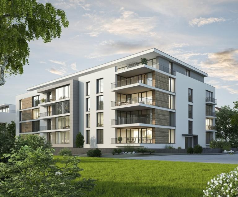 Résidence moderne en immobilier neuf, illustrant un investissement locatif de qualité avec des appartements neufs et des espaces verts.